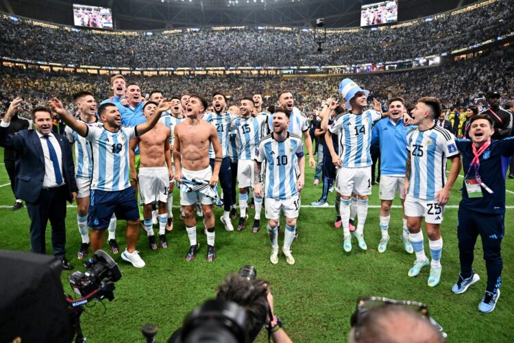 LUSAIL CITY, QATAR - DECEMBER 18: Players of Argentina celebrates in front of their fans after defeating France in the penalty shootout to win the World Cup Final during the FIFA World Cup Qatar 2022 Final match between Argentina and France at Lusail Stadium on December 18, 2022 in Lusail City, Qatar. (Photo by Tullio Puglia - FIFA/FIFA via Getty Images)